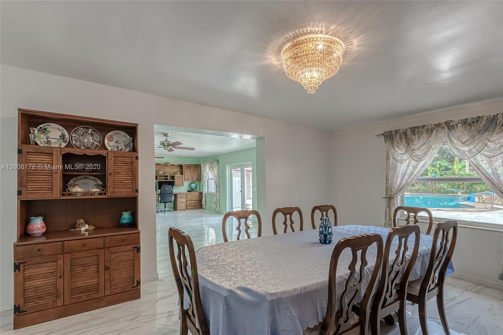 4860 Southwest 193rd Lane Southwest Ranches, FL 33332 - Photo 60 of 80 a view of a dining room with furniture window and outside view