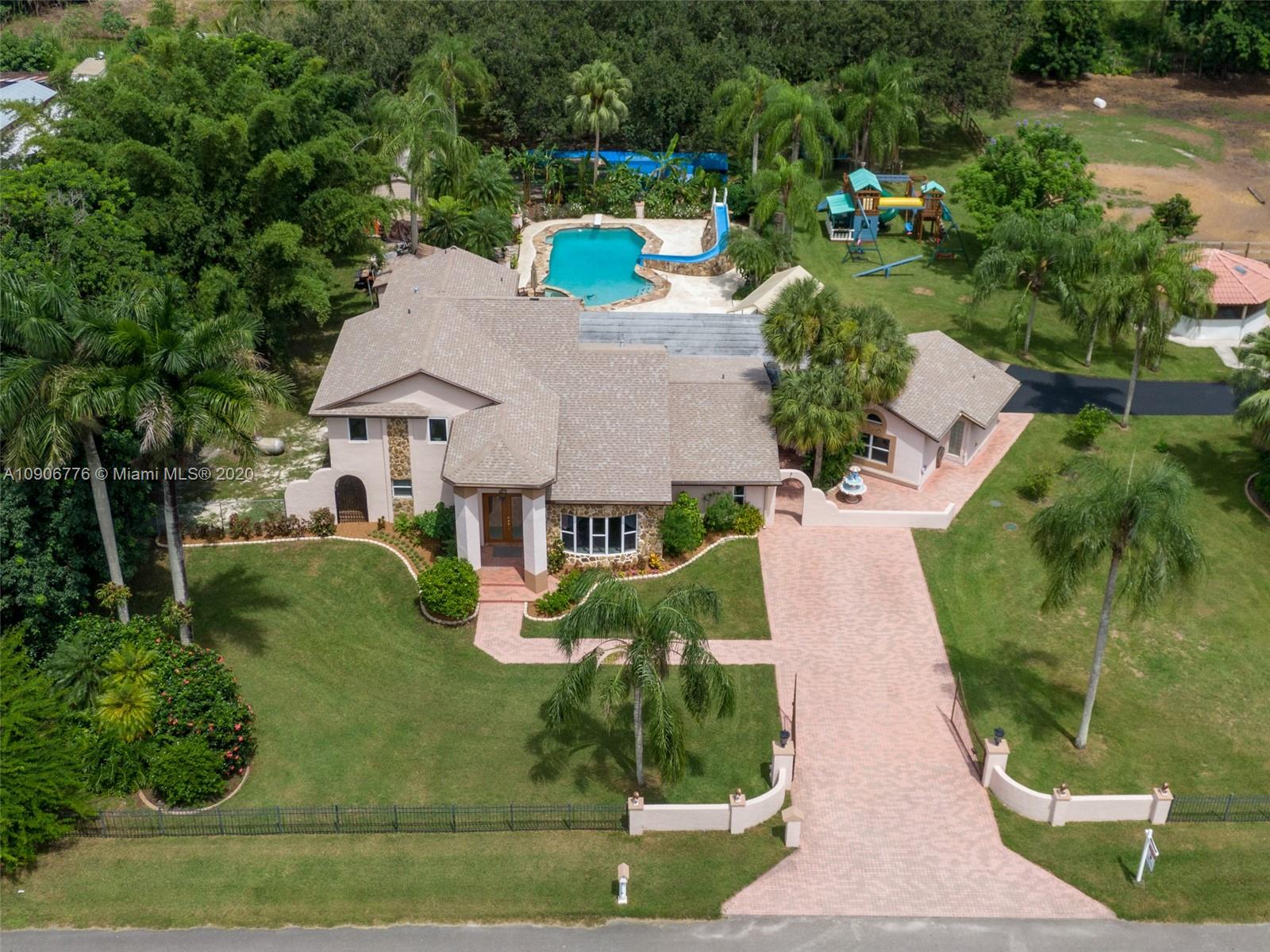 4860 Southwest 193rd Lane Southwest Ranches, FL 33332 - Photo 10 of 80 an aerial view of a house with a yard