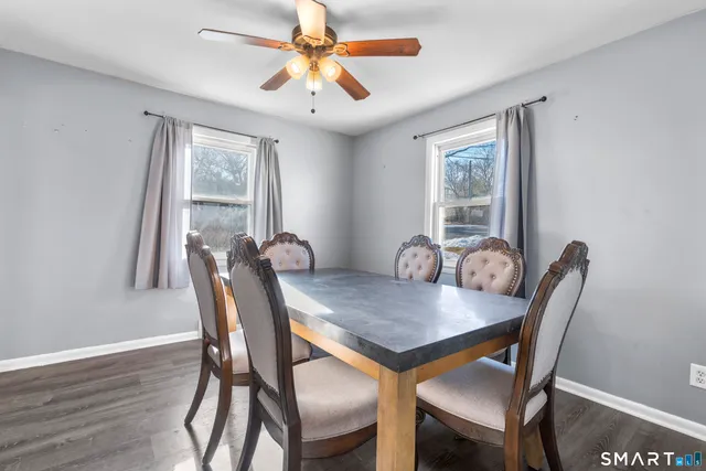 a view of a dining room with furniture window and wooden floor