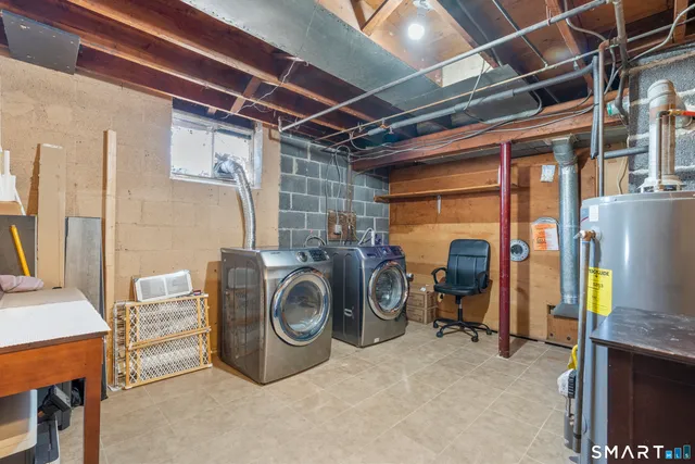 a view of a chairs and table in backyard