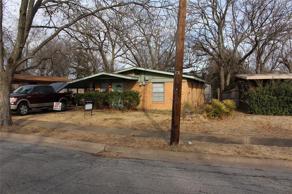 625 South Andrews Avenue Sherman, TX 75090 - Photo 1 of 17 a front view of a house with a yard and garage