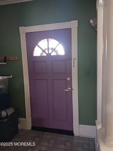 a view of living room with furniture and a fireplace