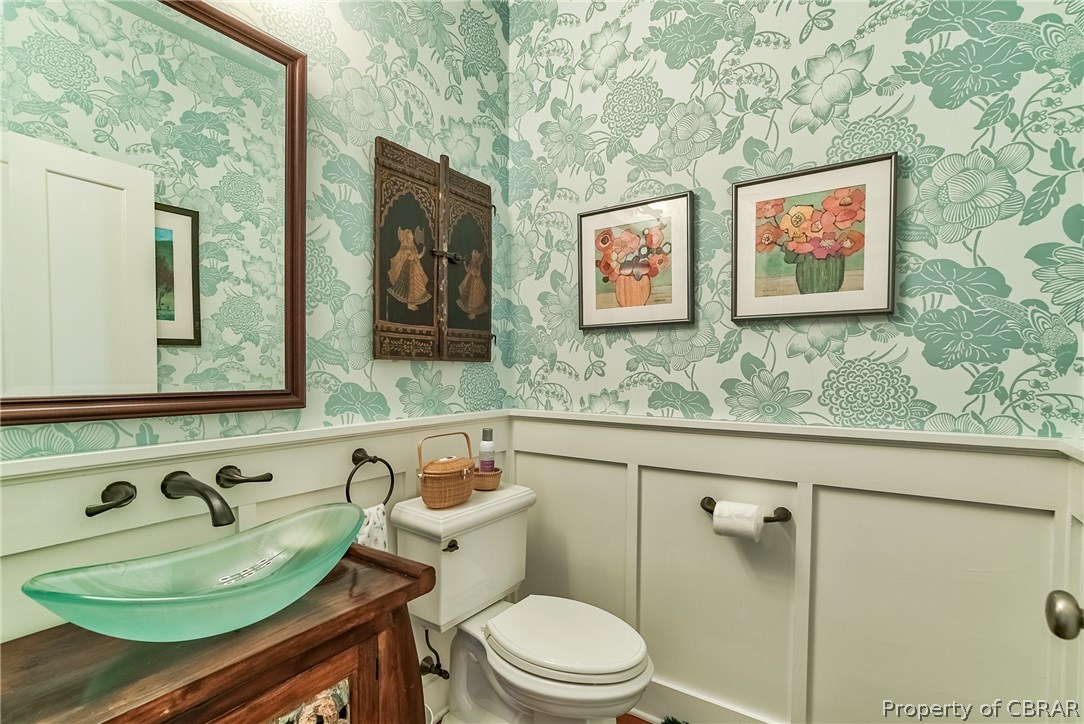 904 Queenstown Road Lancaster, VA 22503 - Photo 20 of 40 Powder Room: 5 x 5 with cherry floors, custom wainscoting, designer wall paper, and custom antique vanity.