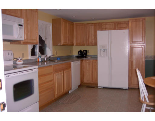 15 Newcomb Road Westminster, MA 01473 - Photo 2 of 6 a kitchen with stainless steel appliances granite countertop a refrigerator sink and cabinets