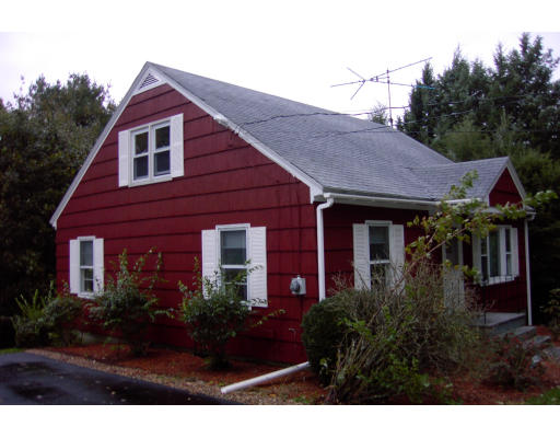 15 Newcomb Road Westminster, MA 01473 - Photo 6 of 6 a view of a house with brick walls and flower plants