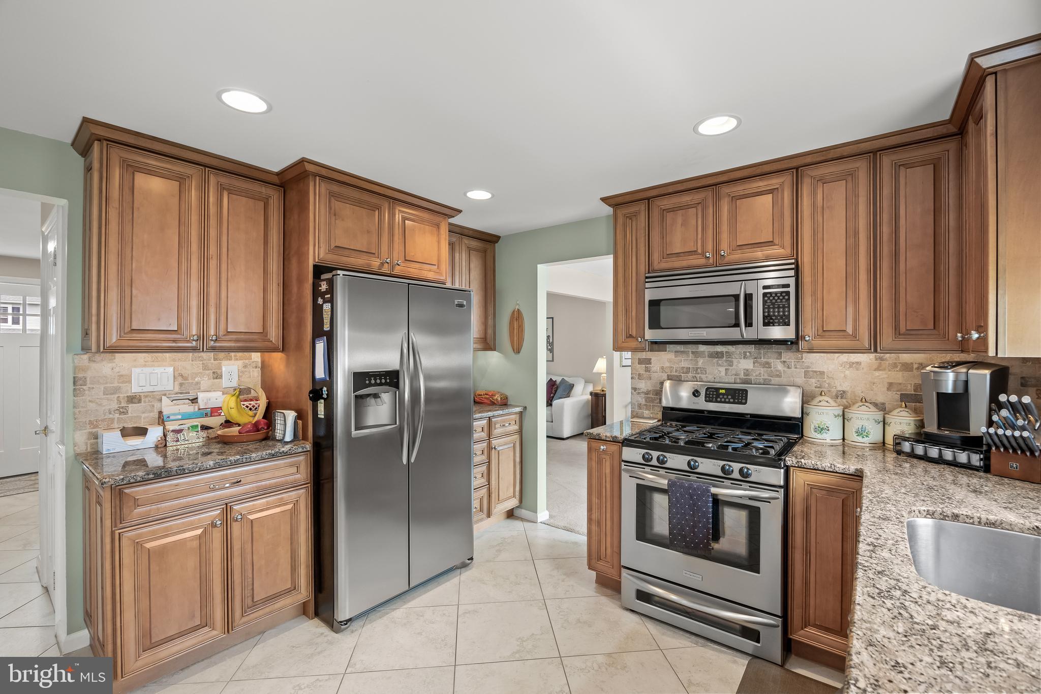 52 Yale Road Marlton, NJ 08053 - Photo 13 of 39 a kitchen with stainless steel appliances granite countertop a refrigerator stove and sink