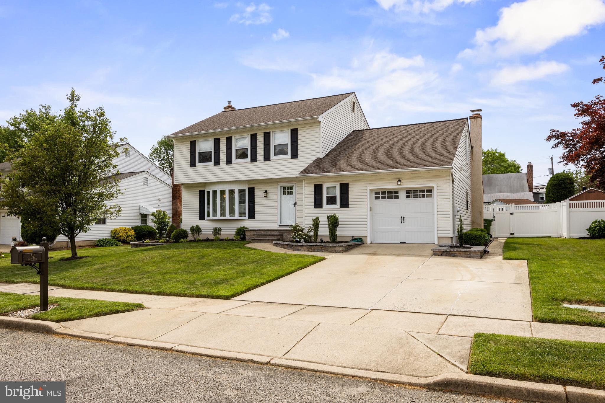52 Yale Road Marlton, NJ 08053 - Photo 3 of 39 a front view of a house with a garden and trees