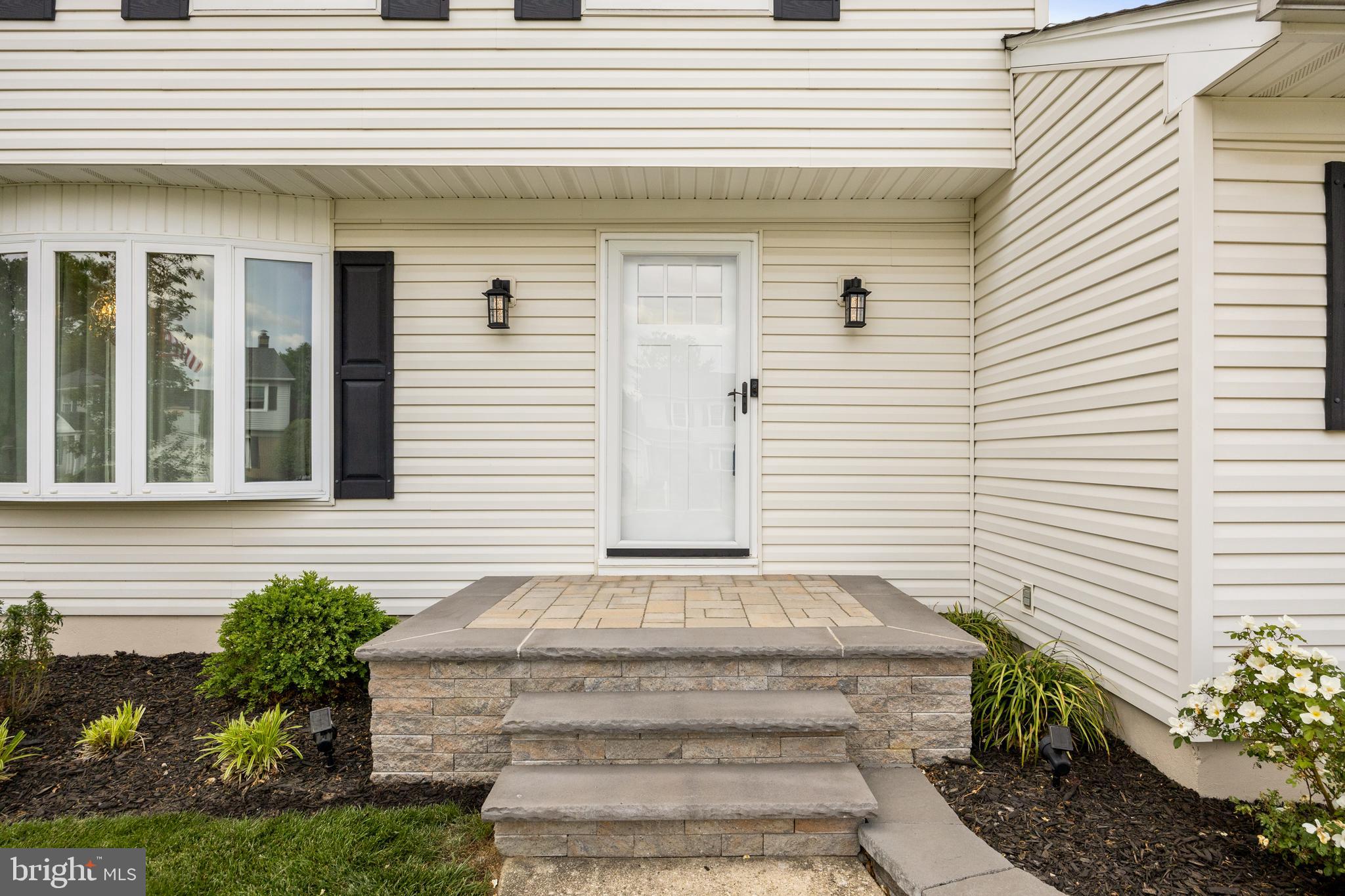52 Yale Road Marlton, NJ 08053 - Photo 5 of 39 a front view of a house with potted plants