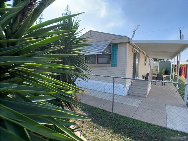 a view of a house with a back yard
