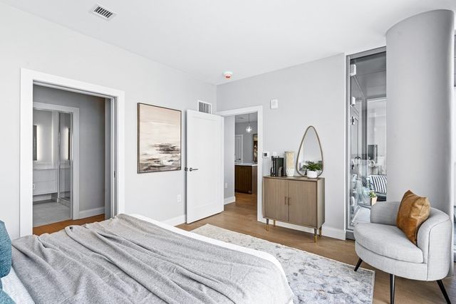 a bedroom with a bed and furniture