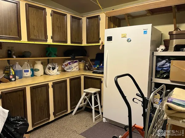 a white refrigerator freezer sitting inside of a kitchen