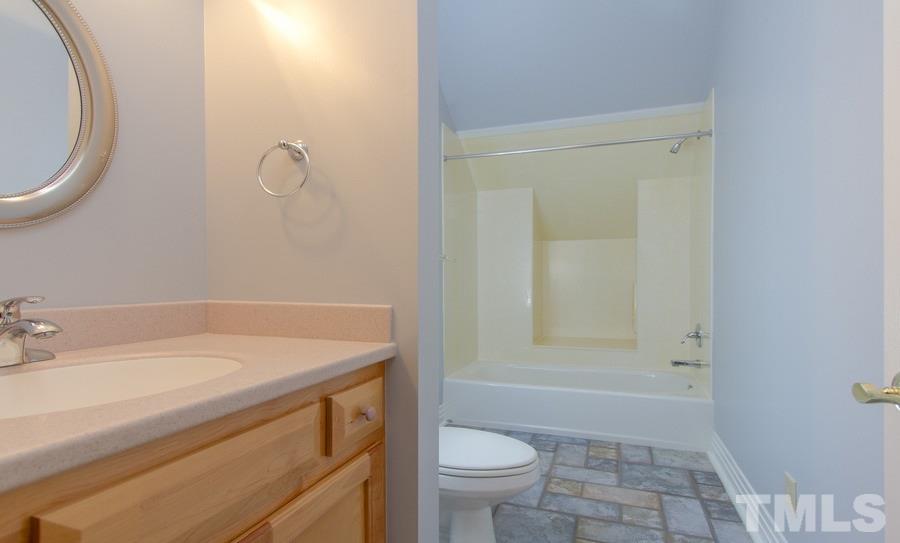 5508 Watkins Road Wendell, NC 27591 - Photo 17 of 25 a bathroom with a sink a toilet and shower