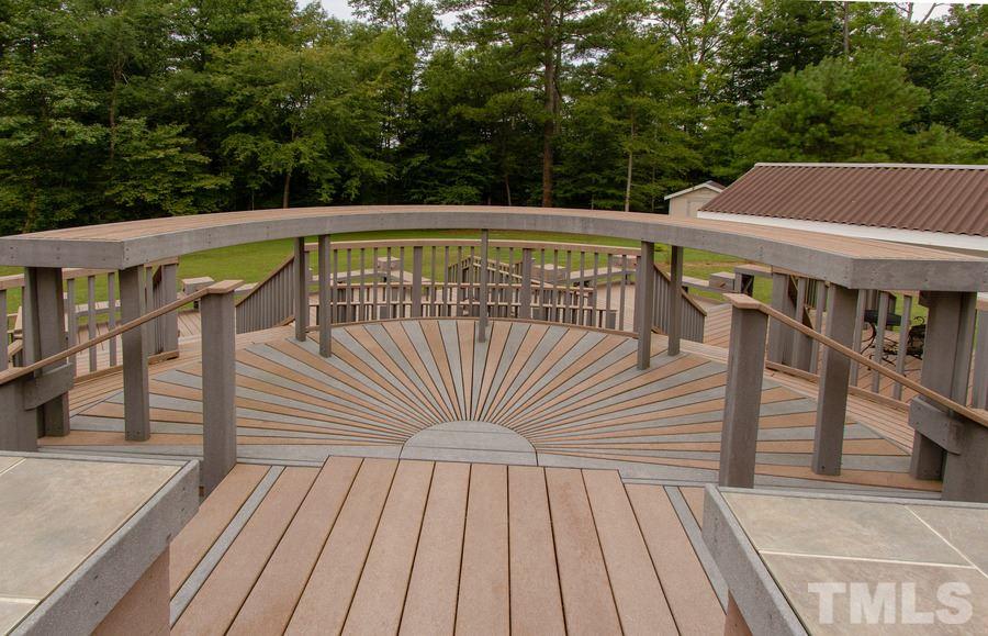 5508 Watkins Road Wendell, NC 27591 - Photo 23 of 25 a view of a roof deck with wooden floor and fence