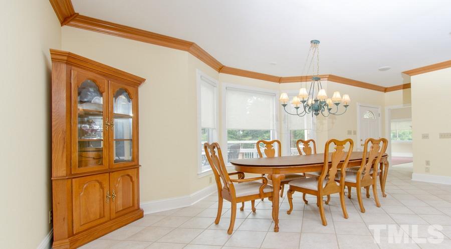 5508 Watkins Road Wendell, NC 27591 - Photo 10 of 25 a view of a dining room with furniture and chandelier