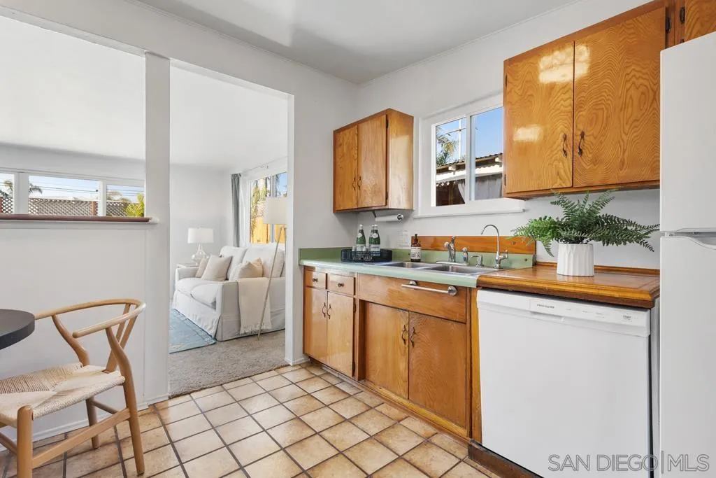 856 Oneonta Avenue Imperial Beach, CA 91932 - Photo 12 of 34 a spacious bathroom with a granite countertop sink and a mirror