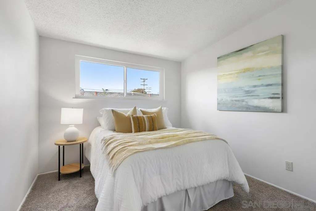 856 Oneonta Avenue Imperial Beach, CA 91932 - Photo 19 of 34 a bedroom with a bed and a painting on the wall