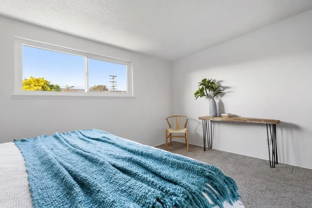 856 Oneonta Avenue Imperial Beach, CA 91932 - Photo 24 of 34 a bedroom with a bed and a table