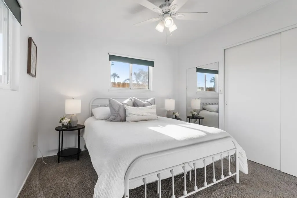 856 Oneonta Avenue Imperial Beach, CA 91932 - Photo 25 of 34 a bedroom with a bed and a chandelier