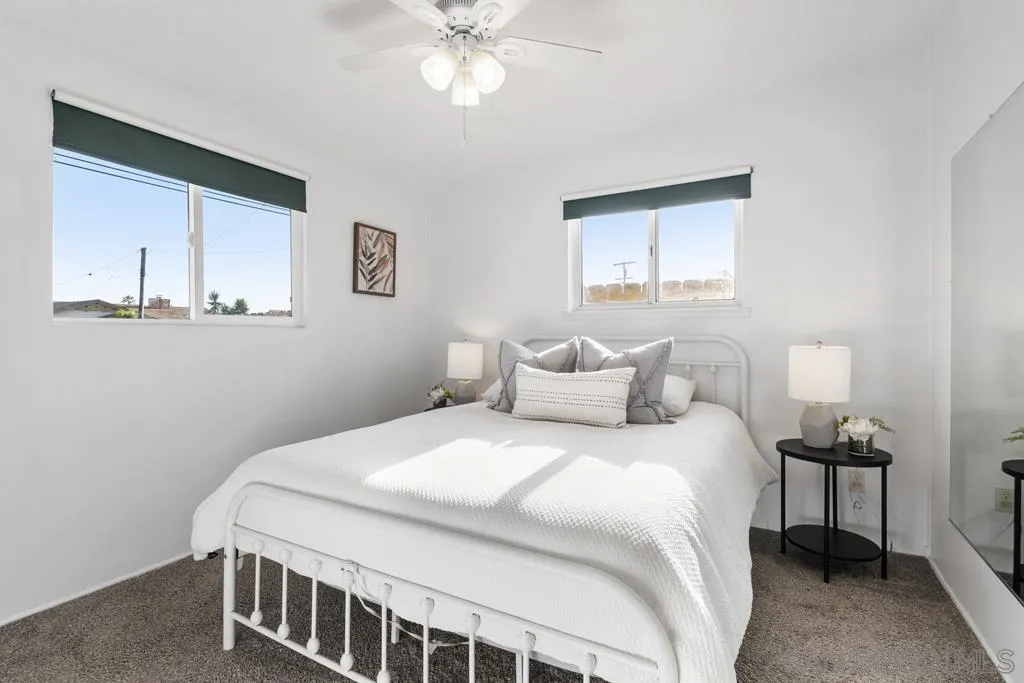 856 Oneonta Avenue Imperial Beach, CA 91932 - Photo 26 of 34 a bedroom with a bed and a chandelier