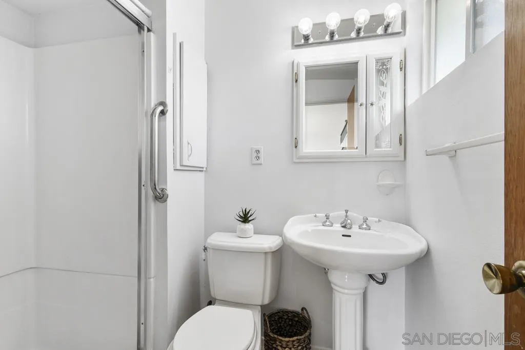 856 Oneonta Avenue Imperial Beach, CA 91932 - Photo 27 of 34 a bathroom with a sink toilet and mirror