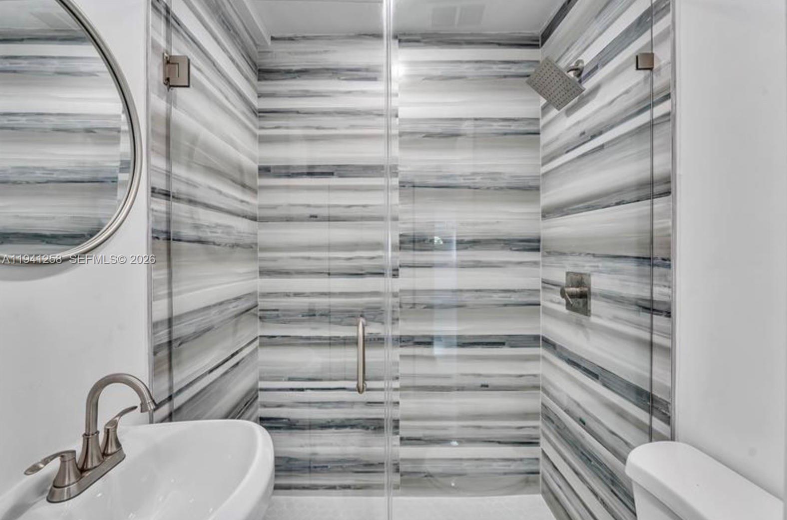 211 Southeast 9th Street Hallandale Beach, FL 33009 - Photo 15 of 16 a view of walk in closet with empty racks