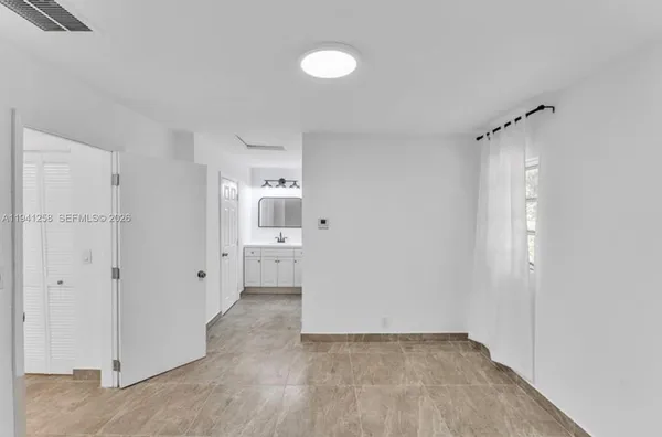 a view of a bathroom with a sink and a shower