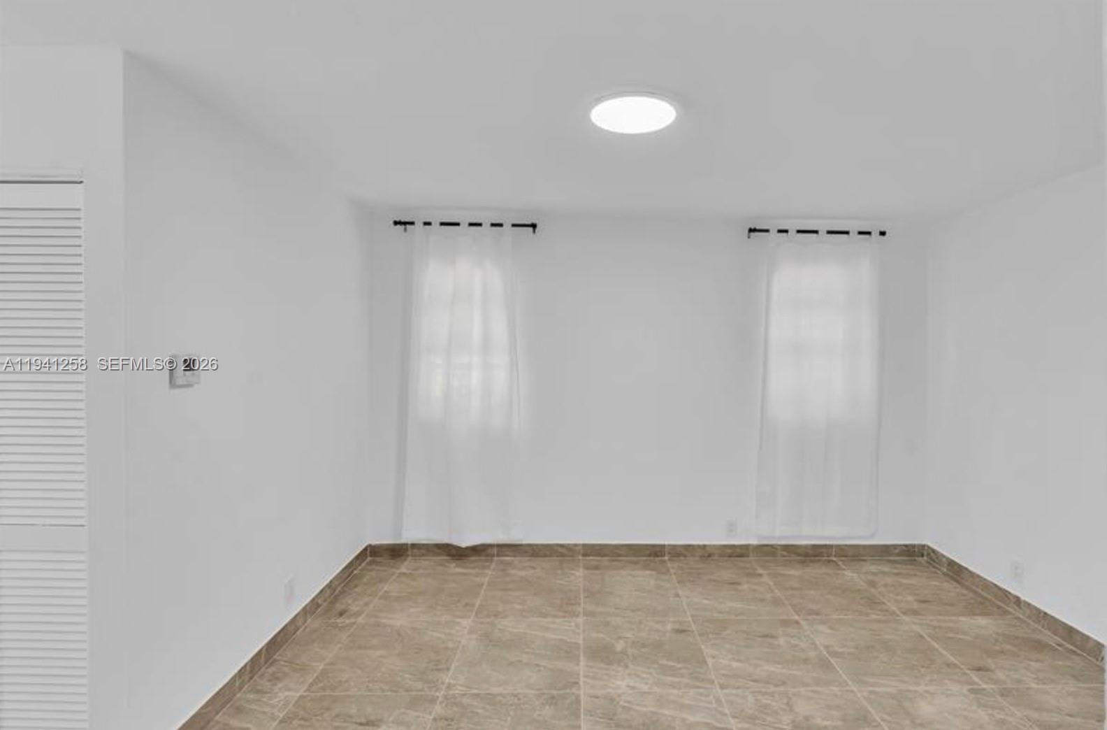 211 Southeast 9th Street Hallandale Beach, FL 33009 - Photo 8 of 16 a view of an empty room