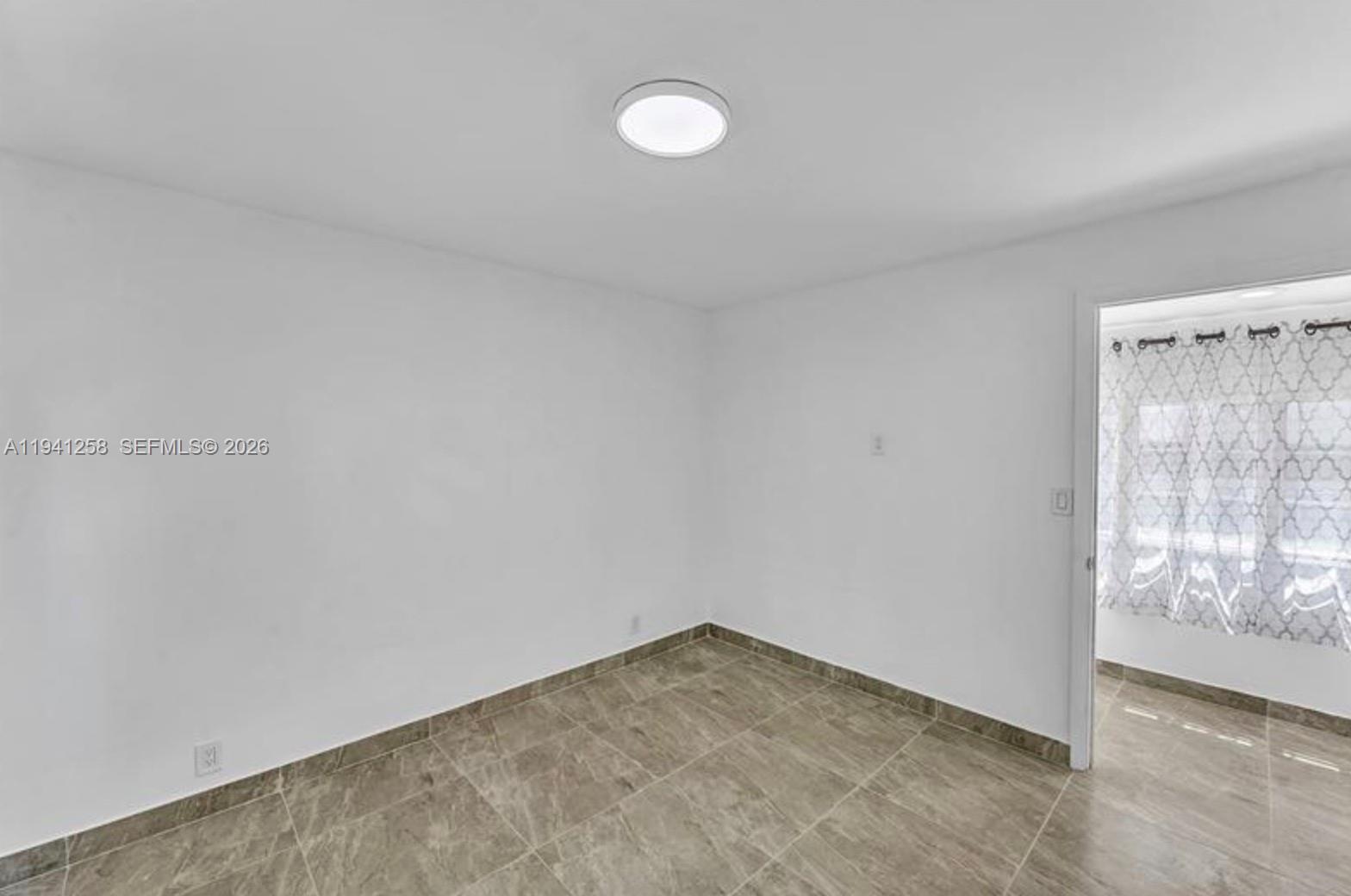 211 Southeast 9th Street Hallandale Beach, FL 33009 - Photo 9 of 16 a view of empty room