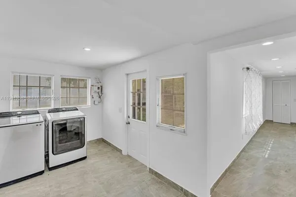 a view of a kitchen with a stove top oven