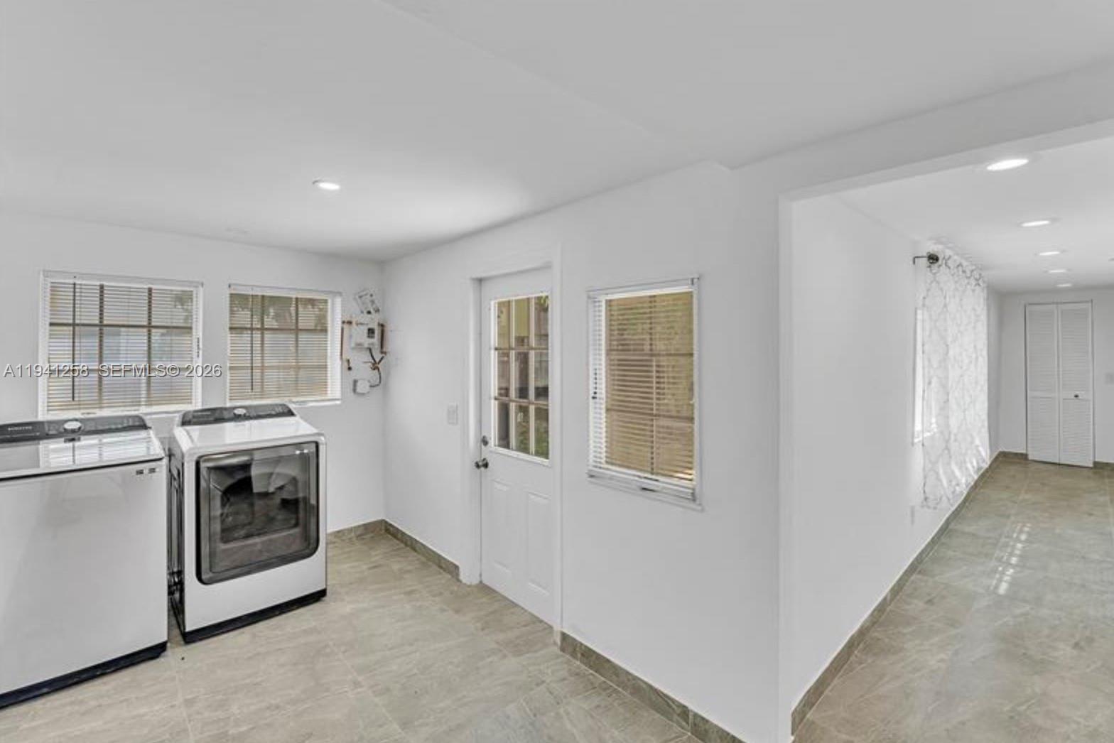 211 Southeast 9th Street Hallandale Beach, FL 33009 - Photo 10 of 16 a view of a kitchen with a stove top oven