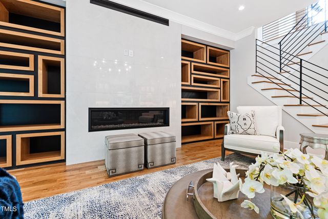 a spacious bedroom with a bed and a chandelier