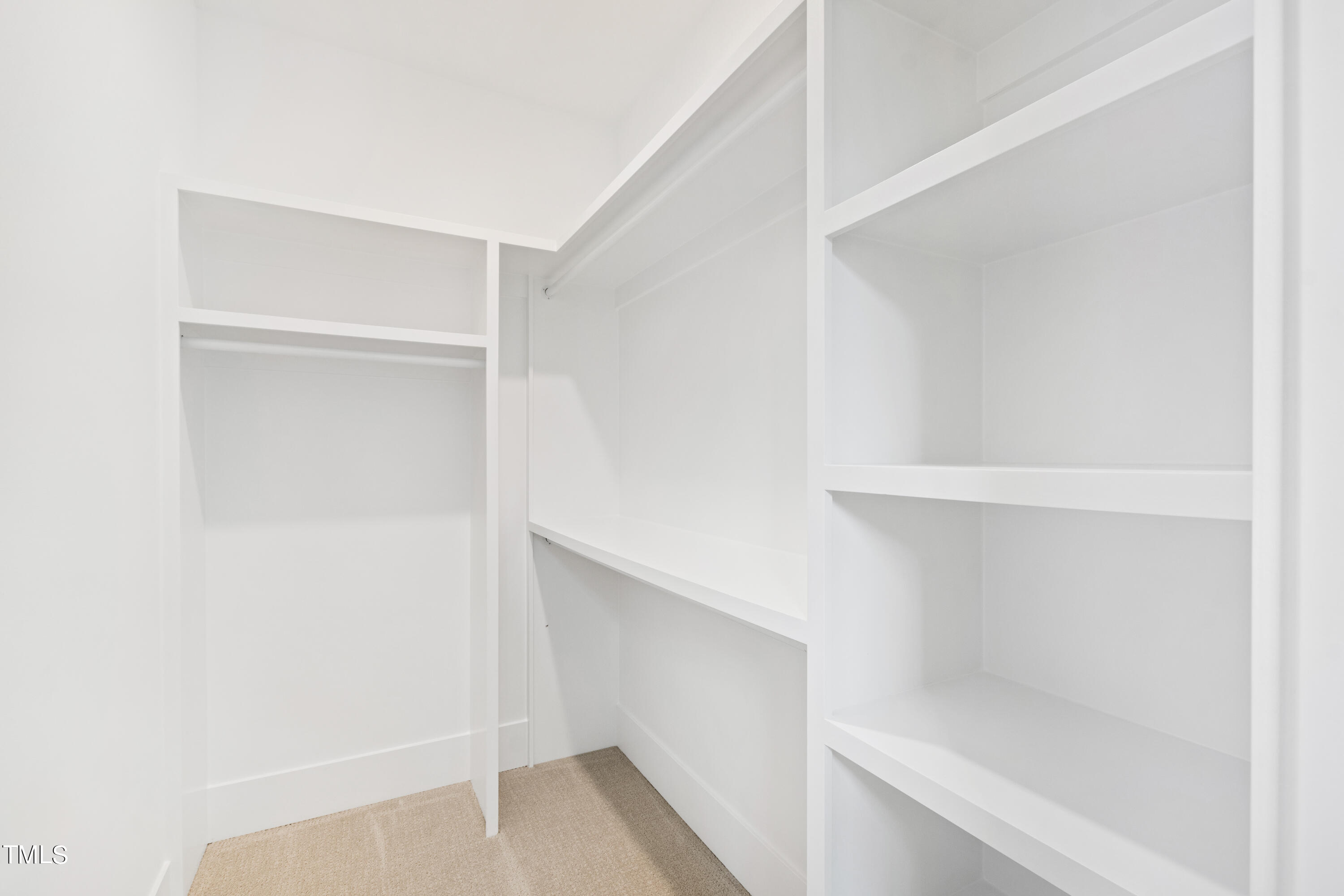 2301 Wheeler Road Raleigh, NC 27612 - Photo 54 of 67 a view of walk in closet with empty racks