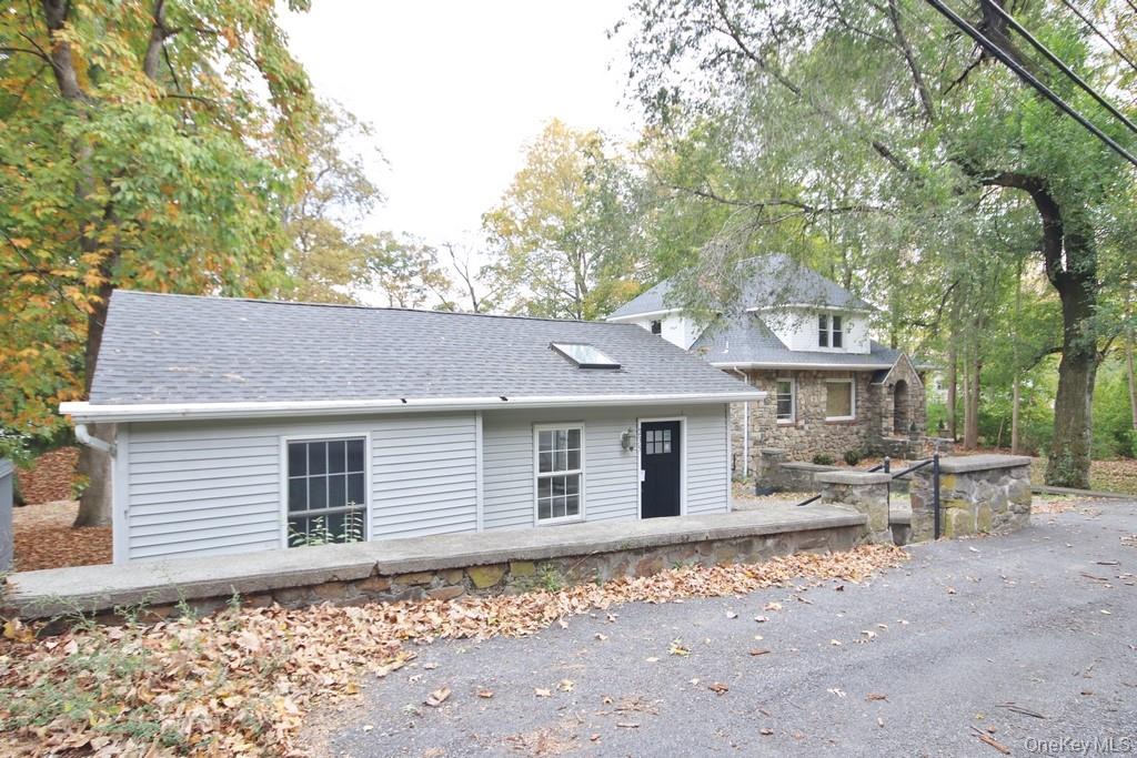 235 Haviland Drive Patterson, NY 12563 - Photo 1 of 18 a backyard of a house with yard and outdoor seating