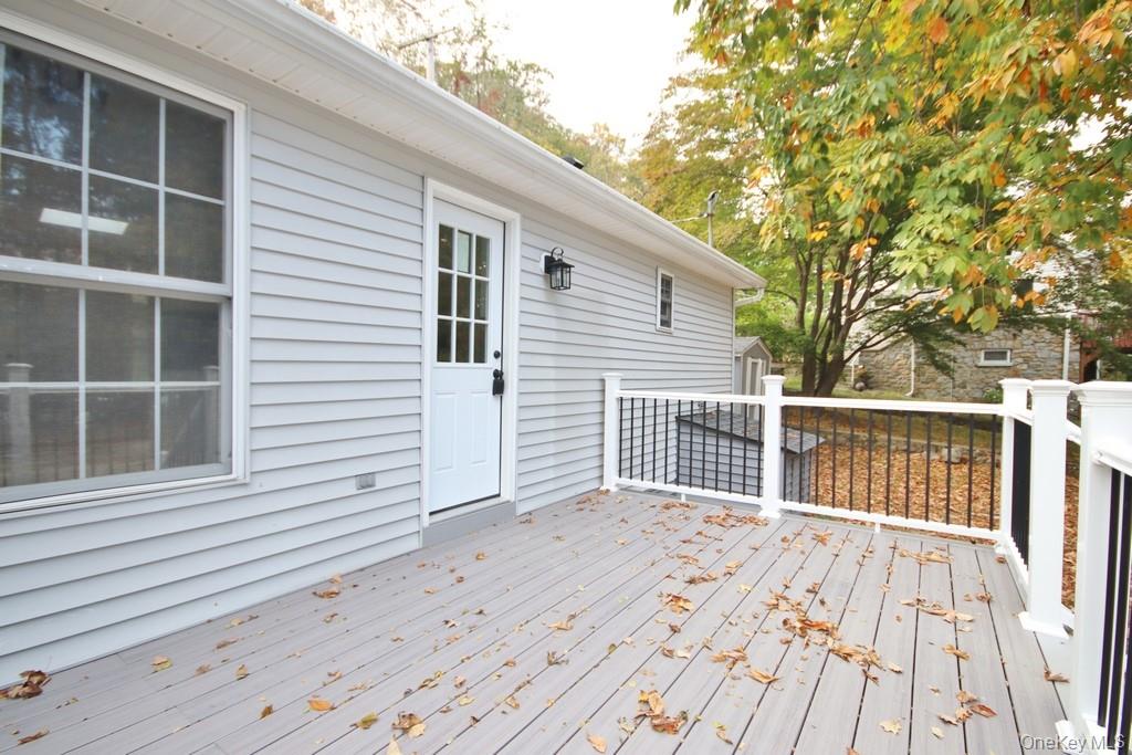 235 Haviland Drive Patterson, NY 12563 - Photo 14 of 18 a view of backyard with a deck