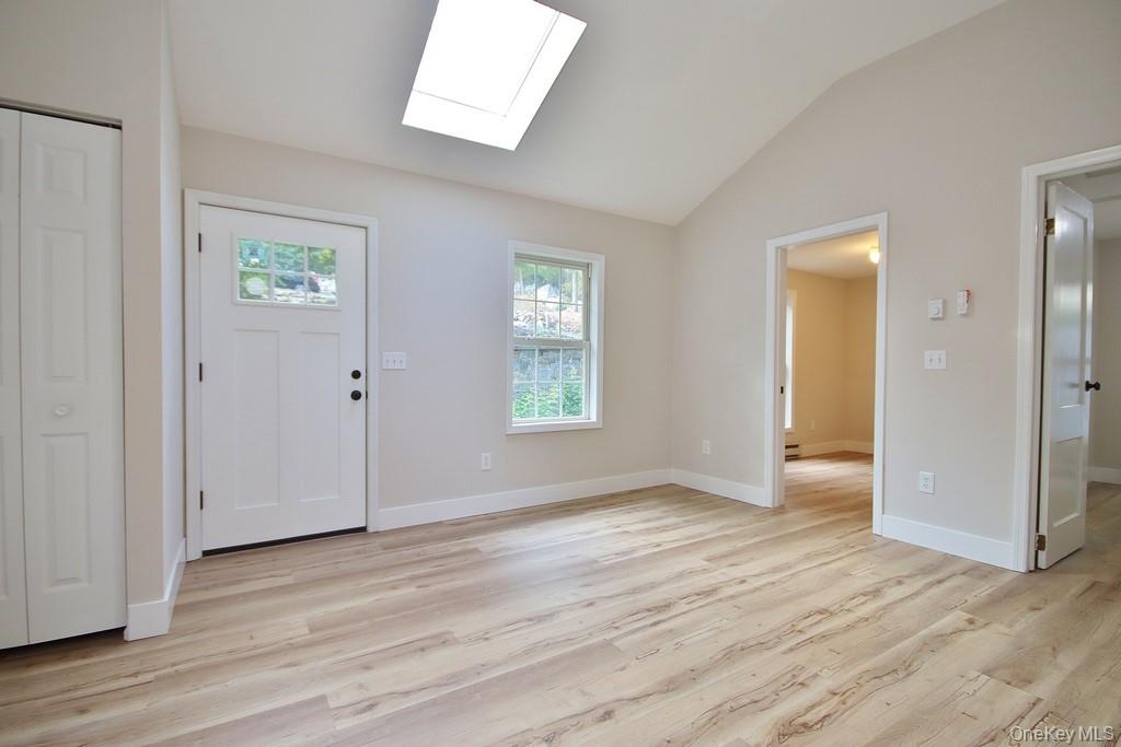 235 Haviland Drive Patterson, NY 12563 - Photo 5 of 18 an empty room with wooden floor and a window
