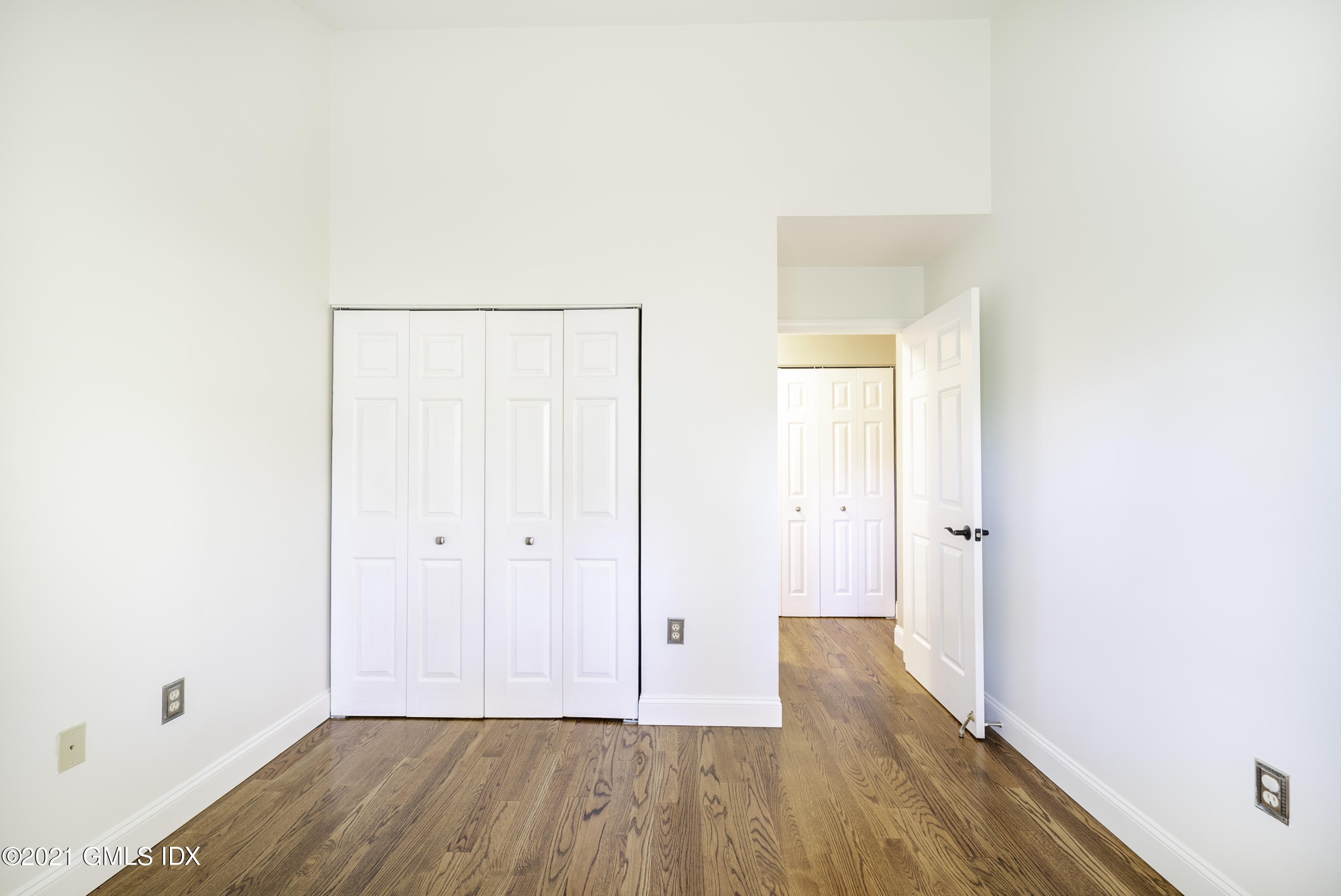 150 Prospect Street, Unit 23 Greenwich, CT 06830 - Photo 16 of 20 a view of a room with wooden floor