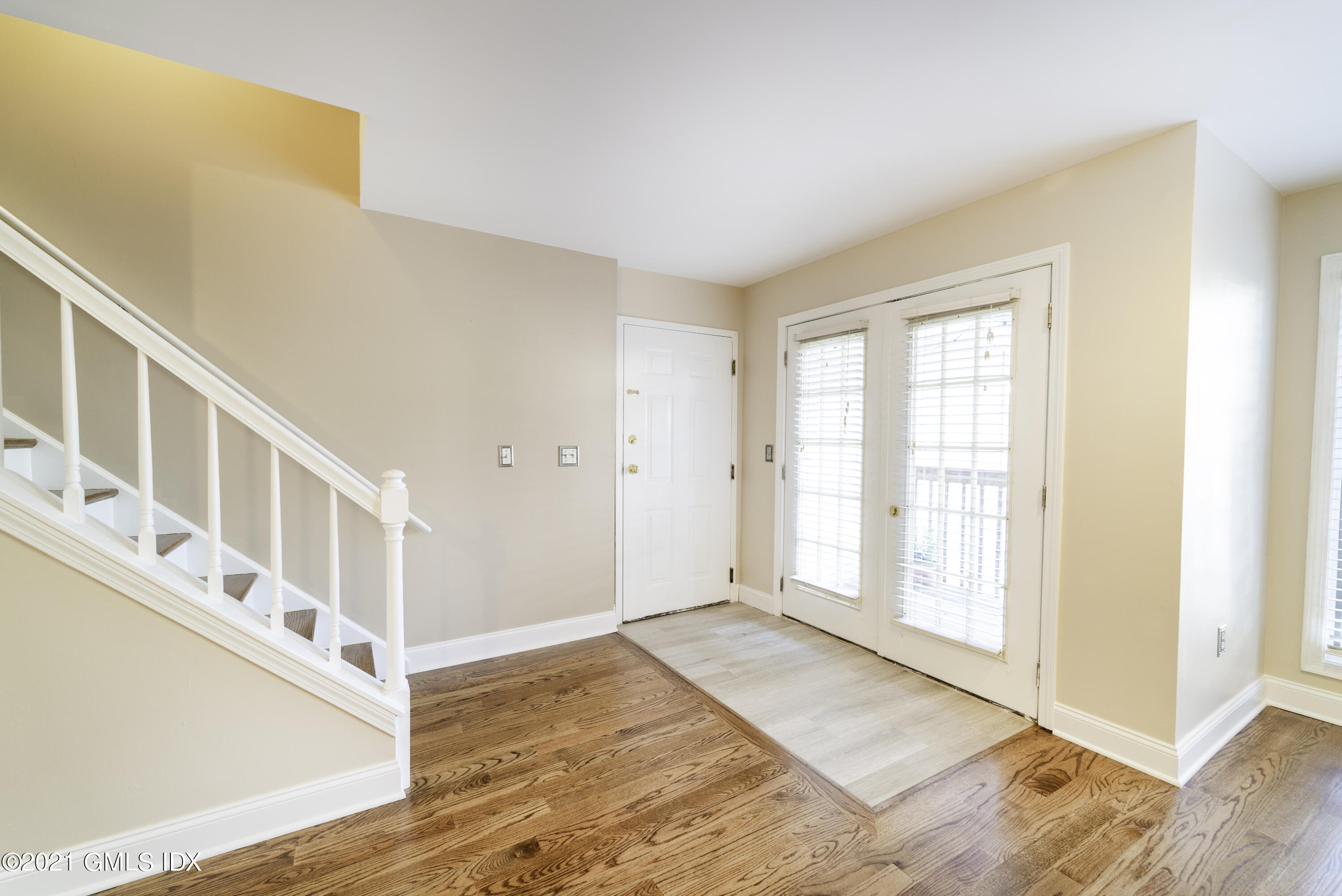 150 Prospect Street, Unit 23 Greenwich, CT 06830 - Photo 2 of 20 a view of an entryway with wooden floor