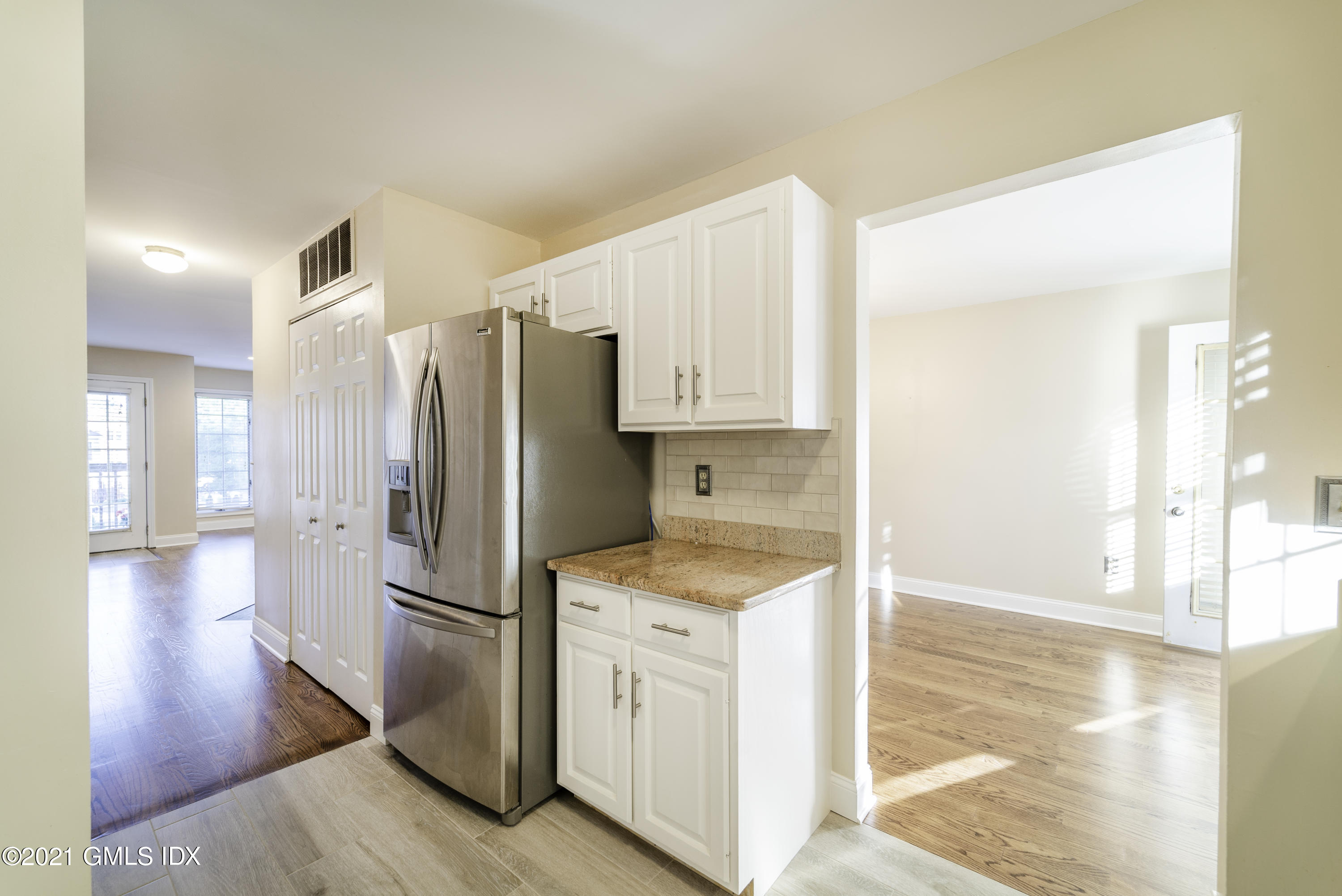 150 Prospect Street, Unit 23 Greenwich, CT 06830 - Photo 10 of 20 a kitchen with a refrigerator sink and cabinets