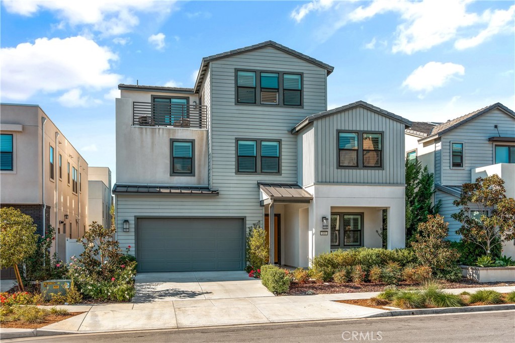 105 Shear Irvine, CA 92618 - Photo 1 of 35 a front view of a house with yard garage and tree