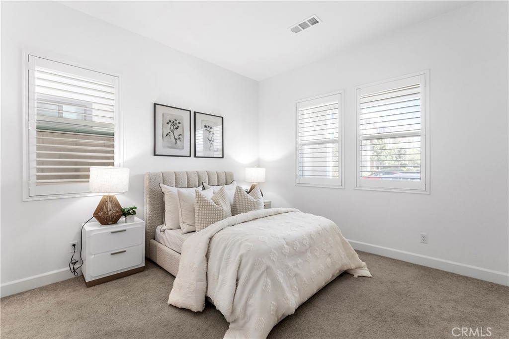 105 Shear Irvine, CA 92618 - Photo 16 of 35 a bed room with two bed and a window