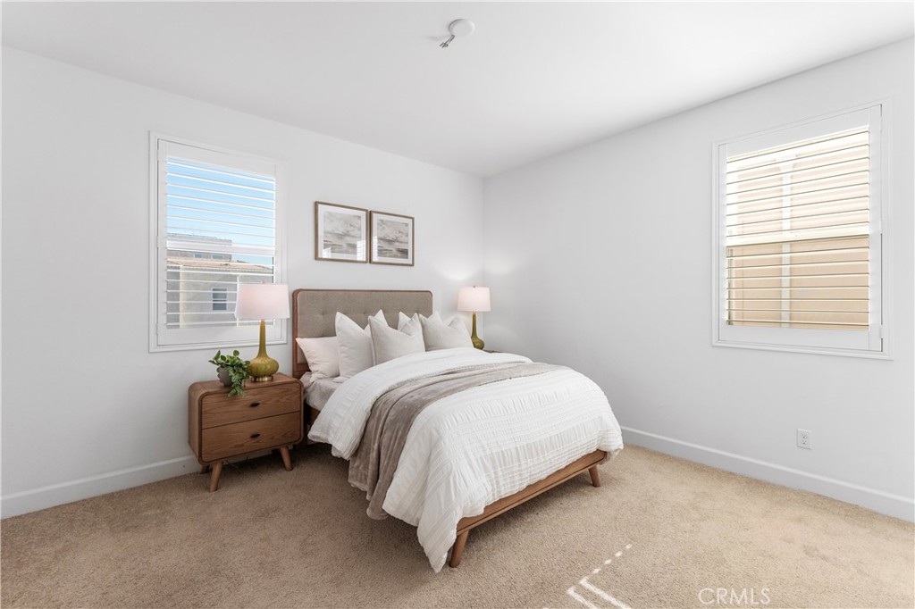 105 Shear Irvine, CA 92618 - Photo 17 of 35 a bed sitting in a bedroom next to a window