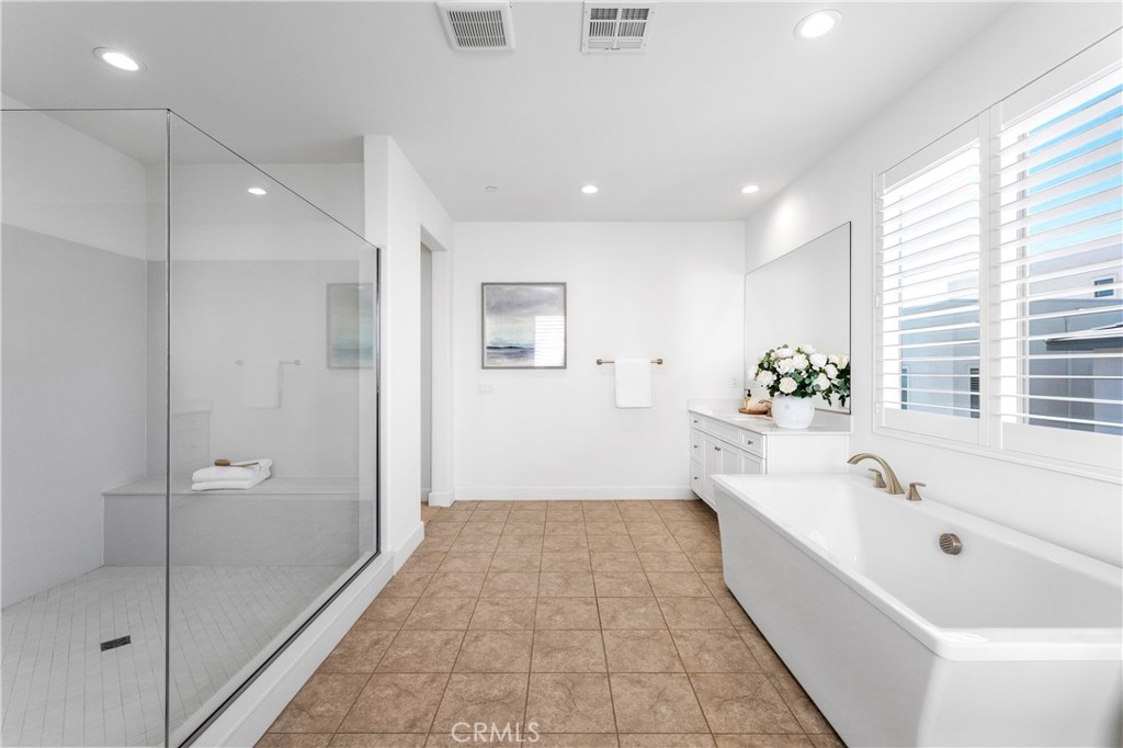 105 Shear Irvine, CA 92618 - Photo 24 of 35 a bathroom with a bathtub and a shower