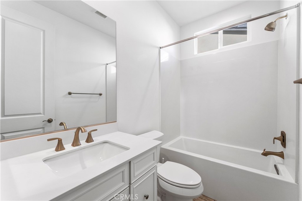 105 Shear Irvine, CA 92618 - Photo 28 of 35 a bathroom with a sink a toilet and shower