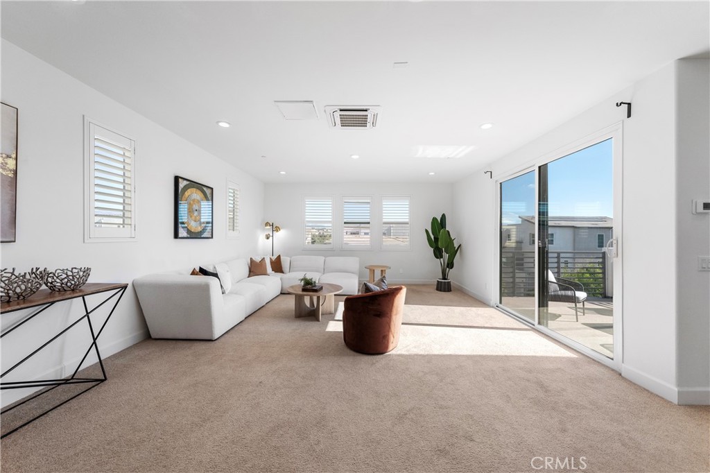 105 Shear Irvine, CA 92618 - Photo 30 of 35 a living room with furniture and white walls