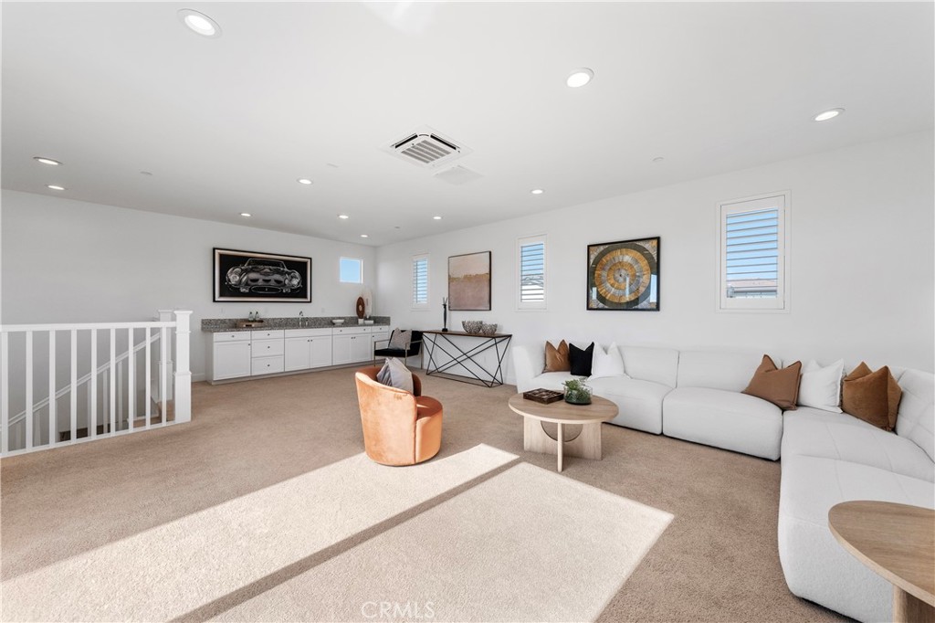 105 Shear Irvine, CA 92618 - Photo 31 of 35 a living room with furniture and a wooden floor