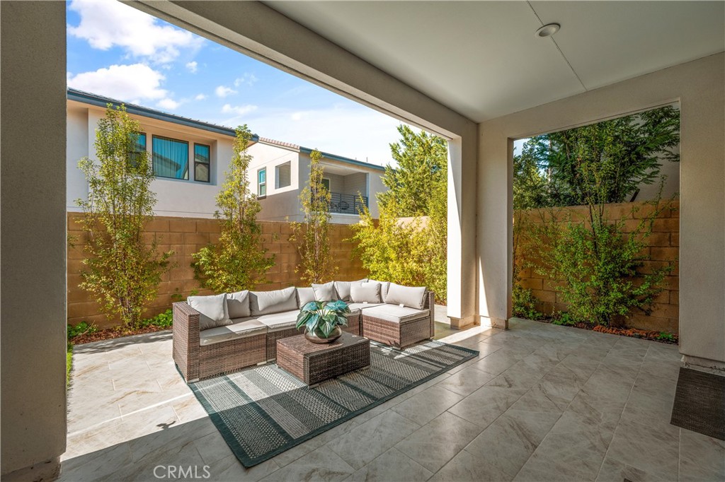 105 Shear Irvine, CA 92618 - Photo 33 of 35 a living room with furniture and a floor to ceiling window
