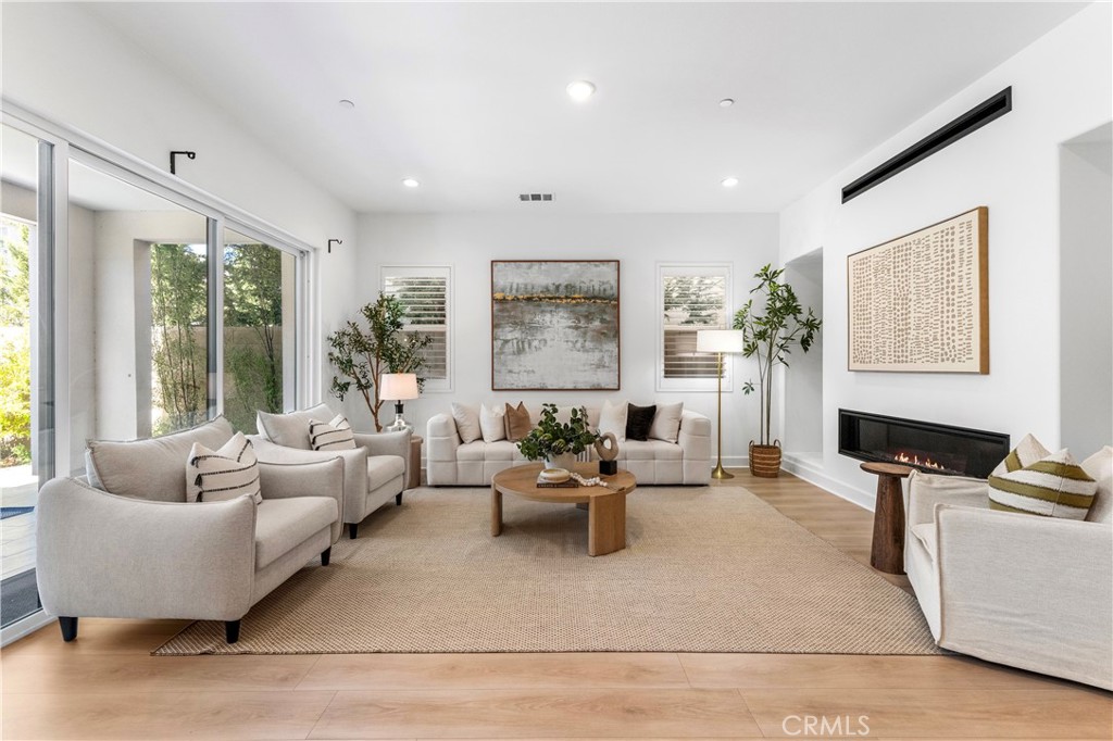 105 Shear Irvine, CA 92618 - Photo 5 of 35 a living room with furniture or couch and a large window
