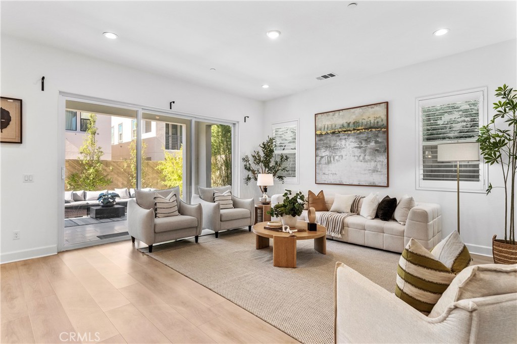 105 Shear Irvine, CA 92618 - Photo 6 of 35 a living room with furniture and a large window