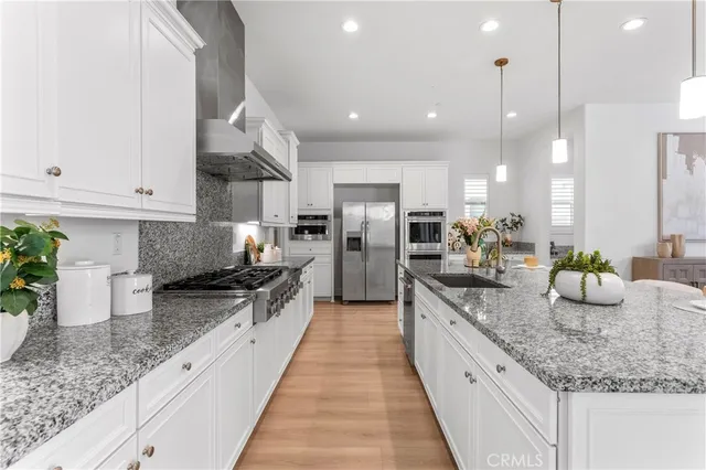 a large kitchen with granite countertop lots of counter space and window