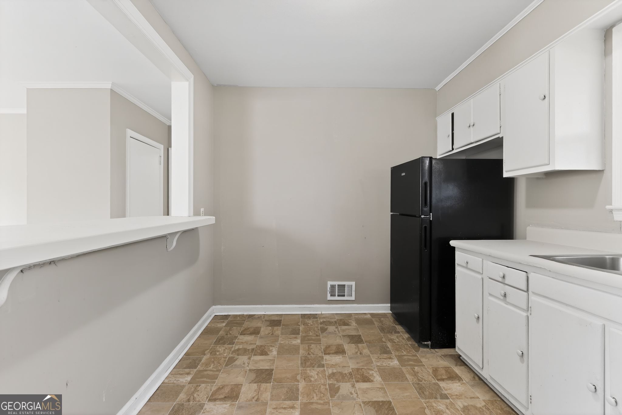 2835 Fairmount Street Augusta, GA 30906 - Photo 11 of 30 a kitchen with a refrigerator and a stove